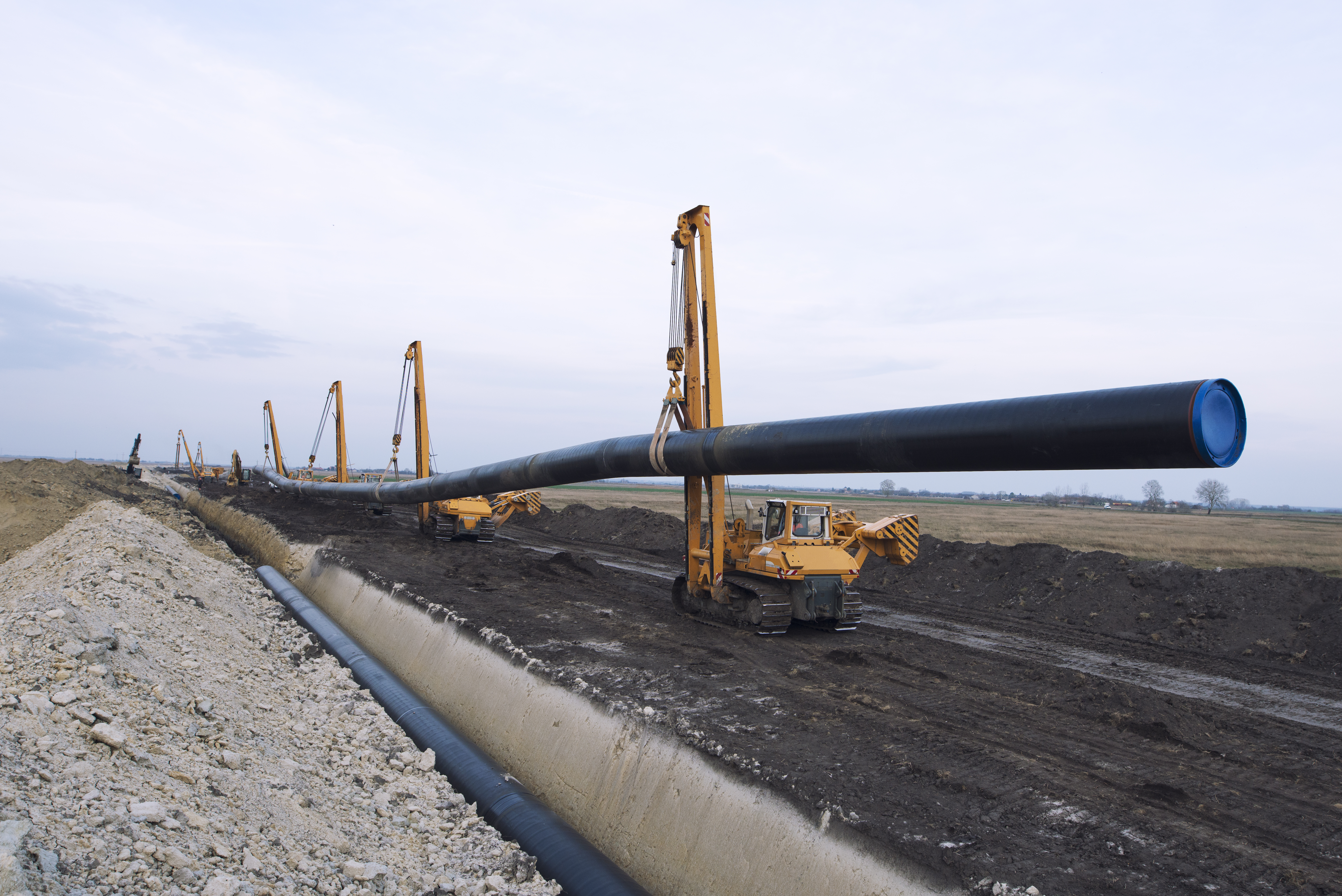 Pipeline installation with heavy equipment on site
